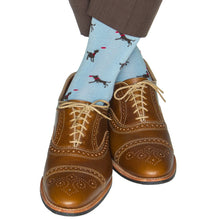 SKY BLUE WITH COFFEE BROWN DOG CATCHING RED FRISBEE