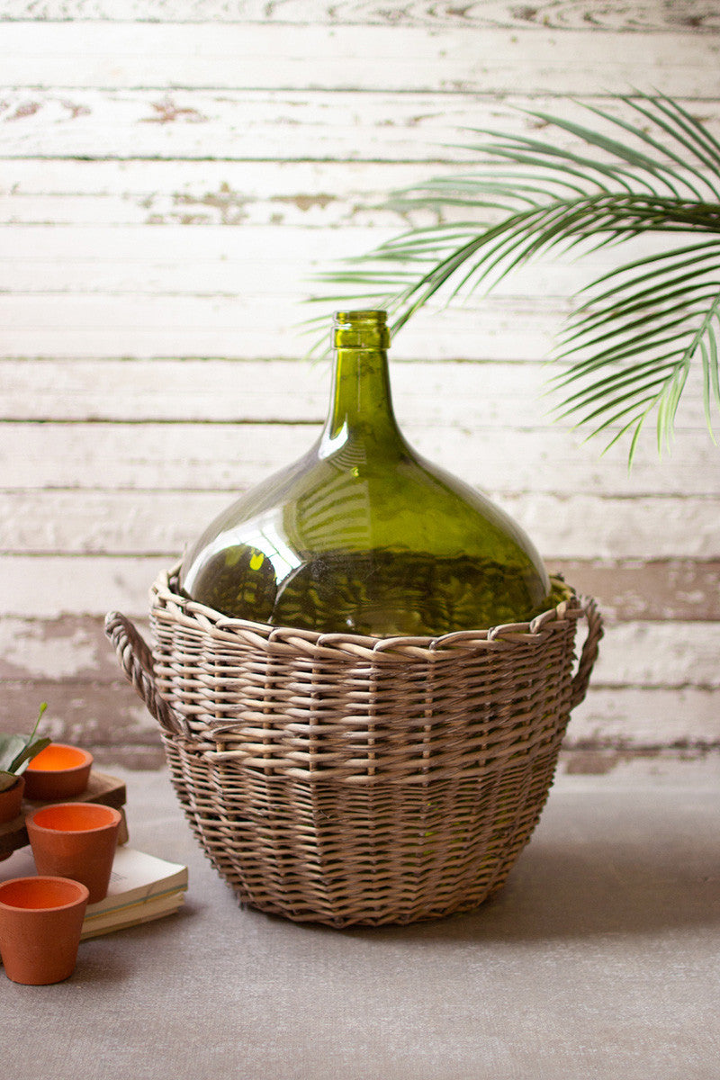 large green glass damigiana with wicker wrap